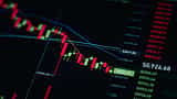 A digital stock market chart displaying a sharp downward trend with red candlesticks on a dark screen.