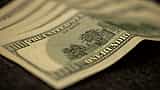 A moody macro close-up of a US one hundred dollar bill.