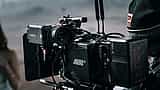 A close-up of a professional ARRI cinema camera rigged on a film set.