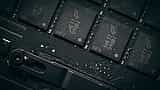 A close-up view of black computer memory chips mounted on a dark circuit board.