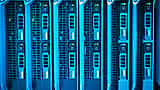 Rows of illuminated server racks in a highly advanced modern data center.