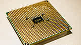 A detailed close-up of a modern microprocessor chip mounted on a circuit board.