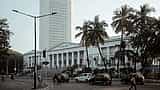 The white tower of the Reserve Bank of India headquarters rises behind the historic Asiatic Society Library in Mumbai.
