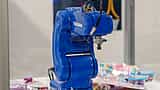 A blue Yaskawa industrial robot arm on display.