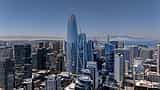 The Salesforce Tower stands prominently in the center of the San Francisco skyline on a clear day.