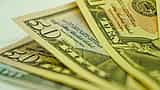 A macro shot detailing the intricate design elements and print on United States dollar bills.