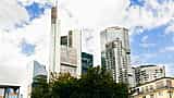 The Commerzbank Tower stands prominently among other modern skyscrapers in the bright Frankfurt skyline.