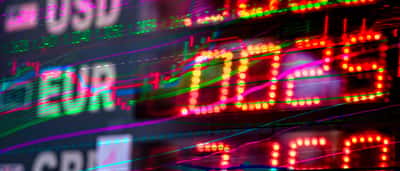 A glowing, dynamic electronic trading board displaying international currencies like USD, EUR, and GBP.