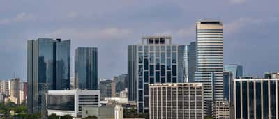 Modern glass skyscrapers rise in a business district of São Paulo, Brazil.
