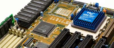 A close-up view of an Intel 486DX2 processor chip mounted on a motherboard.