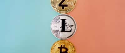 Three cryptocurrency coins, including Zcash and Bitcoin, arranged in a vertical line against a split blue and peach background.
