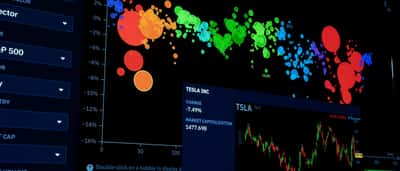 A dark computer screen displaying a colorful, complex bubble chart and financial metrics for stock market analysis.