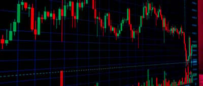 A vibrant close-up of a candlestick chart displaying financial market trends and trading activity.