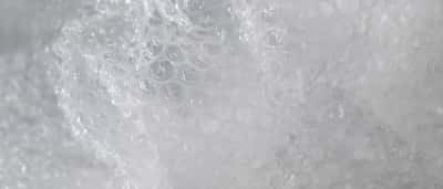 A close-up shot of clear, textured bubble wrap used for packaging and protection.