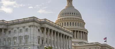 The dome and neoclassical facade of the United States Capitol building in Washington, D.C.