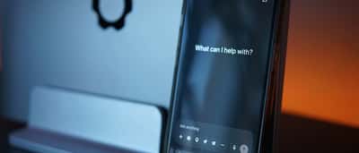A close-up of a smartphone displaying an AI chat interface on its screen.