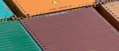 A dense grid of vibrantly colored shipping containers stacked together.