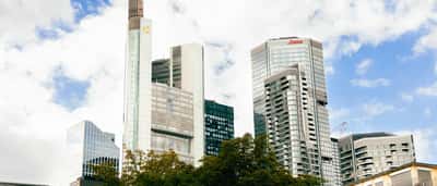 The Commerzbank Tower stands prominently among other modern skyscrapers in the bright Frankfurt skyline.