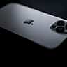 A sleek Apple smartphone with a triple-lens camera rests on a dark surface.