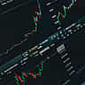 A close-up of a digital screen displaying a rising stock market chart with green candlesticks.