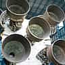 A close-up view of the massive, complex engines of a Saturn V rocket on display.