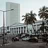 The white tower of the Reserve Bank of India headquarters rises behind the historic Asiatic Society Library in Mumbai.