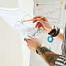 An investor reviews a printed financial chart with a pen in hand.