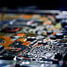 A close-up view of an electronic circuit board with a shallow depth of field.