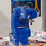 A blue Yaskawa industrial robot arm on display.