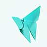 A bright blue origami butterfly folded from paper against a white background.