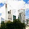 The Commerzbank Tower stands prominently among other modern skyscrapers in the bright Frankfurt skyline.