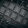 A close-up view of multiple black microchips on a modern electronic circuit board.