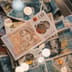 A close-up view of British five and ten pound notes featuring the Bank of England inscription.