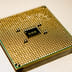 Close-up view of the gold-plated pins on the underside of a modern microprocessor.