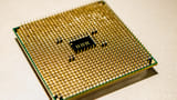 Close-up view of the gold-plated pins on the underside of a modern microprocessor.
