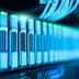 A row of illuminated server racks glowing with blue and green lights in a modern data center.
