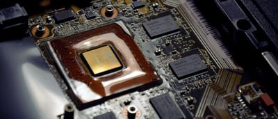 A close-up view of Hynix microchips and a processor on a computer motherboard.
