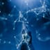 A robotic hand reaching upward to touch a glowing digital network against a deep blue background.