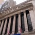 The classic stone columns and facade of the New York Stock Exchange building.