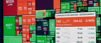 A digital stock market heatmap displaying the performance of various companies grouped by sector, with large blocks representing tech giants like Apple and Microsoft.