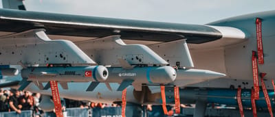 A close-up view of modern missiles mounted on a military aircraft.