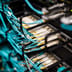 A dense network of bright blue fiber optic cables connected to a patch panel in a modern data center.